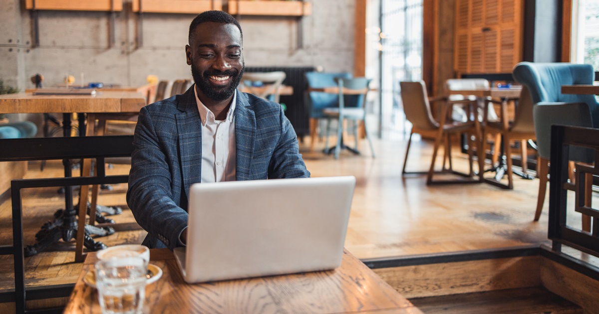 Insurance agent works on laptop