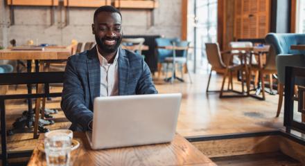 Insurance agent works on laptop